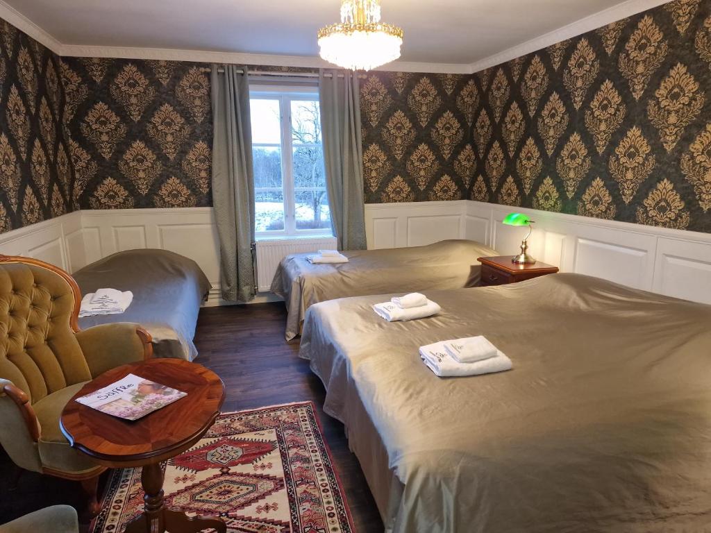 Säng eller sängar i ett rum på Svaneholm Hotel