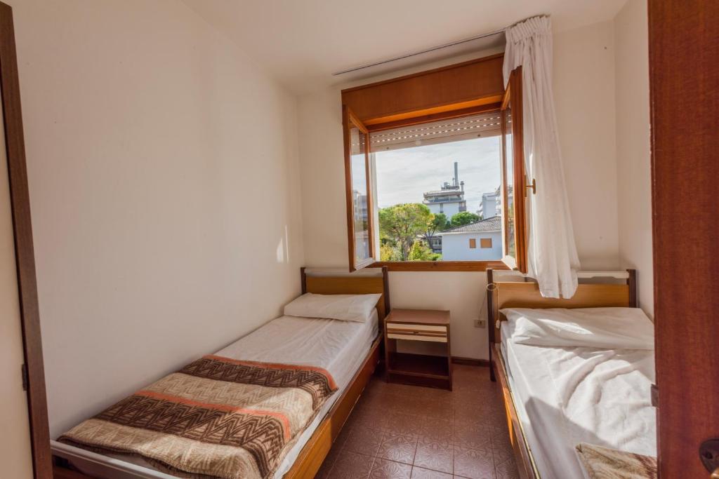 A bed or beds in a room at Altan