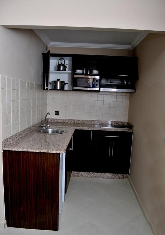 Kuchyň nebo kuchyňský kout v ubytování Suite Hotel Tilila