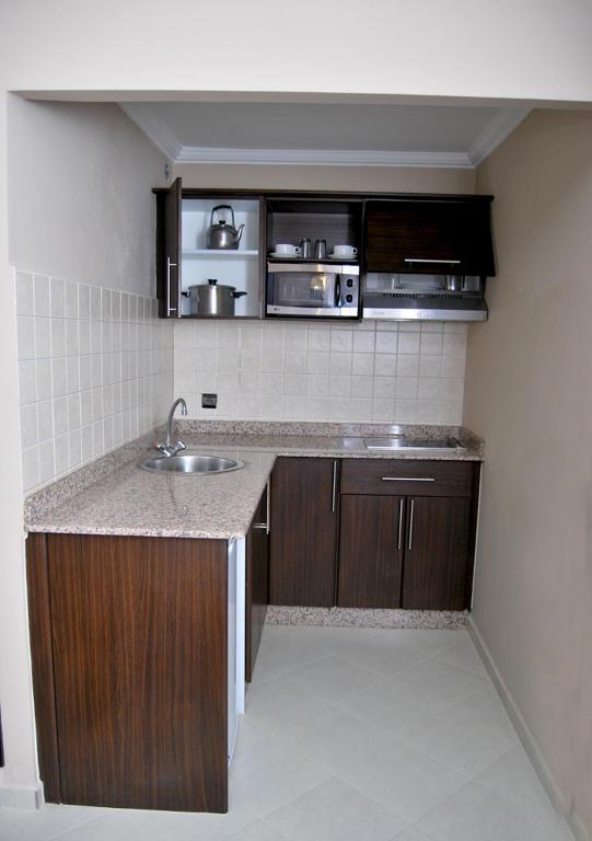 Kuchyň nebo kuchyňský kout v ubytování Suite Hotel Tilila