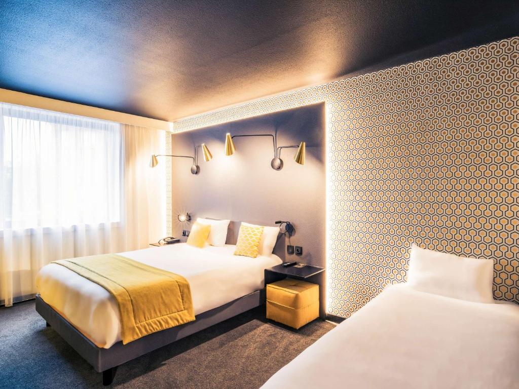 Postel nebo postele na pokoji v ubytování Mercure Arras Centre Gare