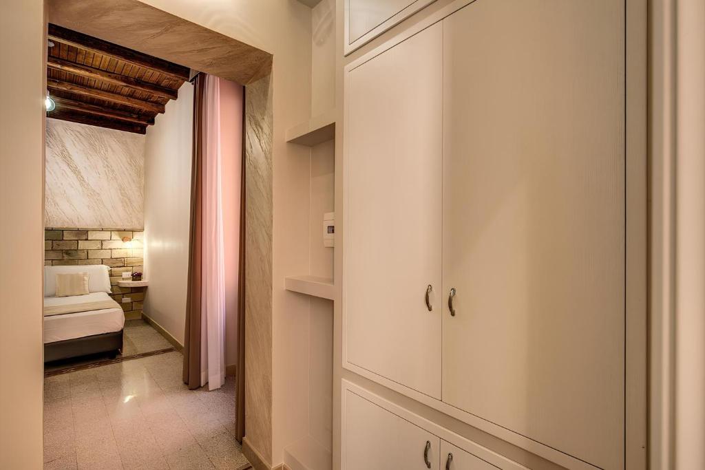 Postel nebo postele na pokoji v ubytování Colosseo Accomodation Room Guest House
