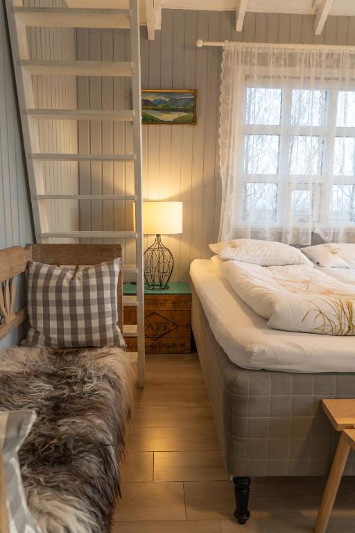 Ένα ή περισσότερα κρεβάτια σε δωμάτιο στο Grund Cabin
