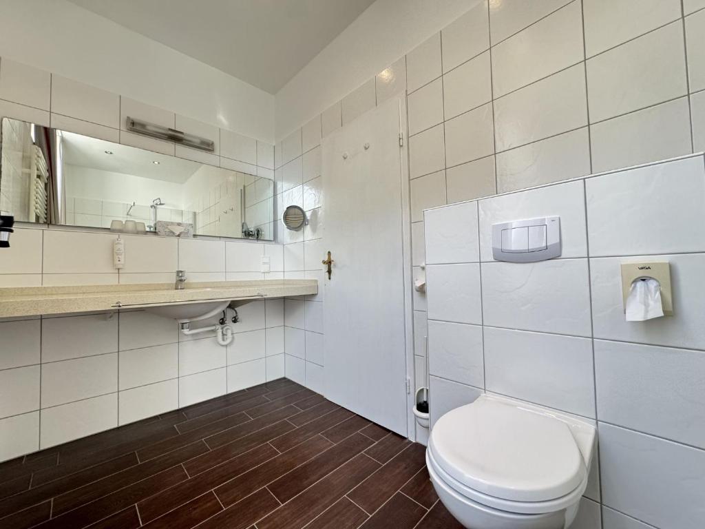 Koupelna v ubytování Hotel Weisse Düne