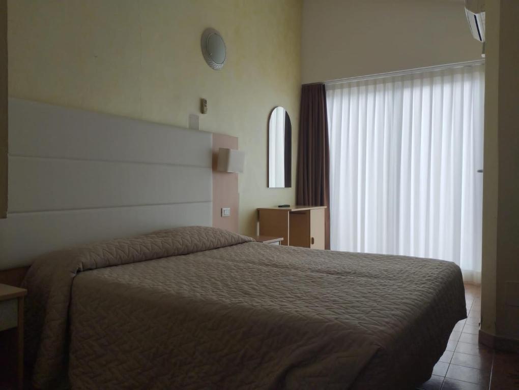 Postel nebo postele na pokoji v ubytování Hotel Foschi-Peninsula