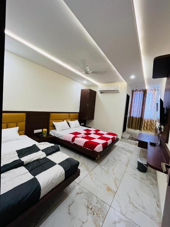 Postel nebo postele na pokoji v ubytování Hotel PRAKASHAM