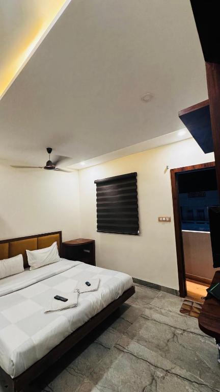 Postel nebo postele na pokoji v ubytování Hotel PRAKASHAM