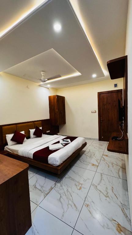 Postel nebo postele na pokoji v ubytování Hotel PRAKASHAM