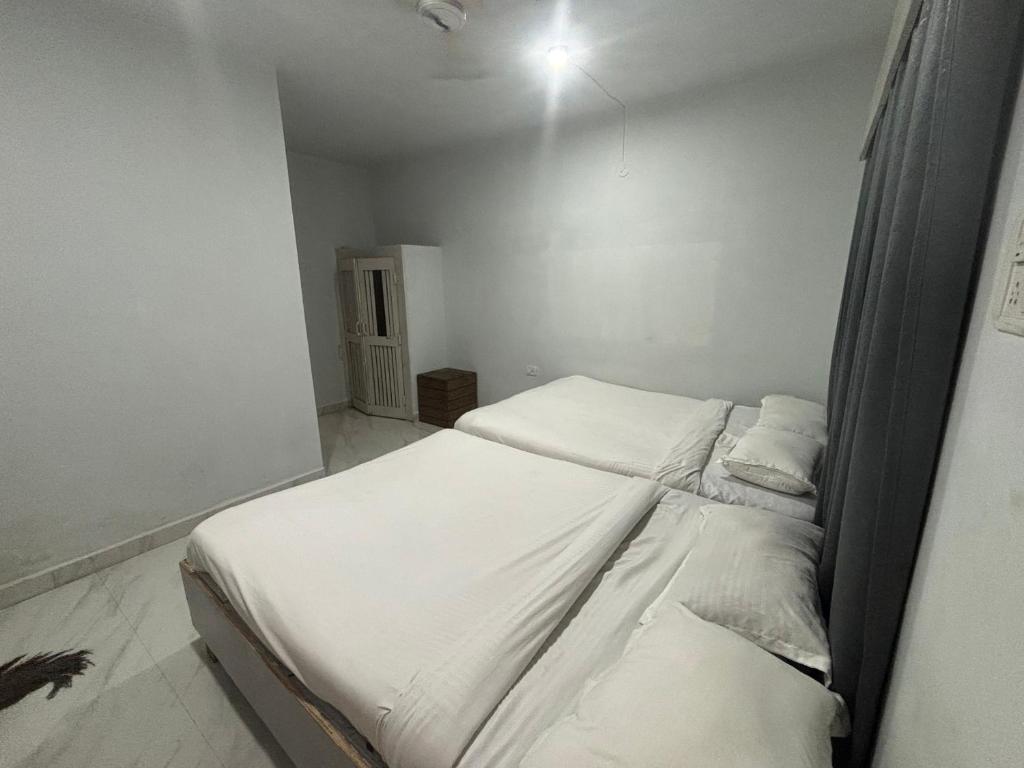 Postel nebo postele na pokoji v ubytování Mehar Rooms