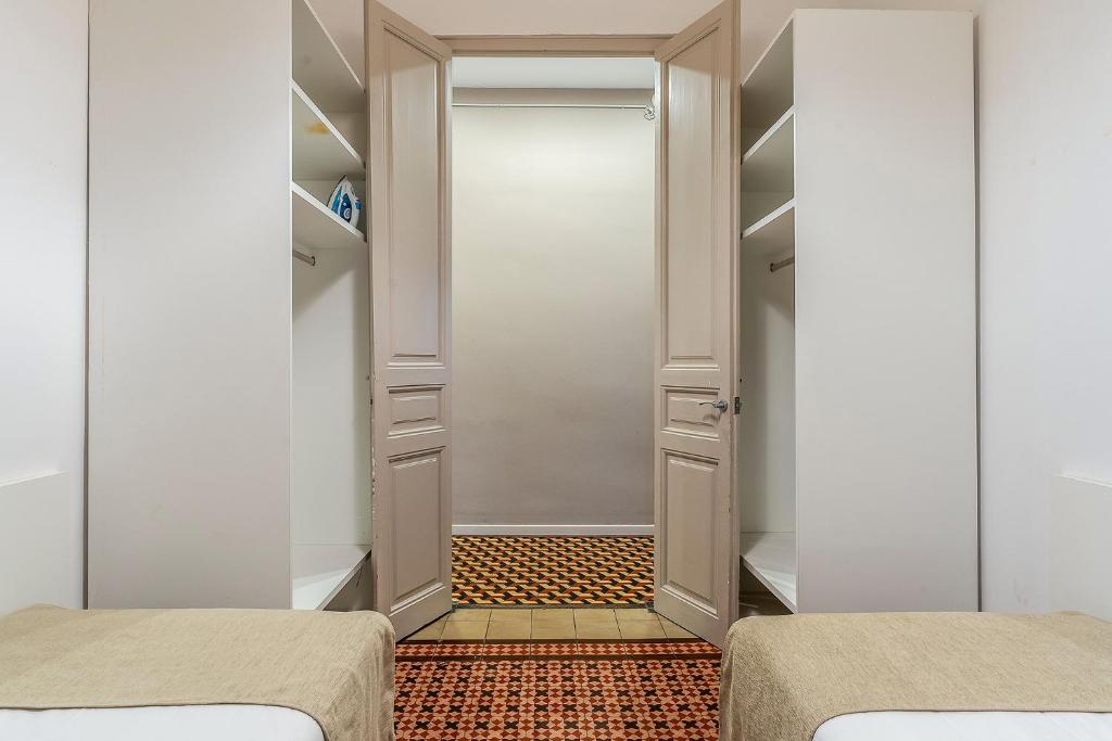 Postel nebo postele na pokoji v ubytování AB Bailen Apartments