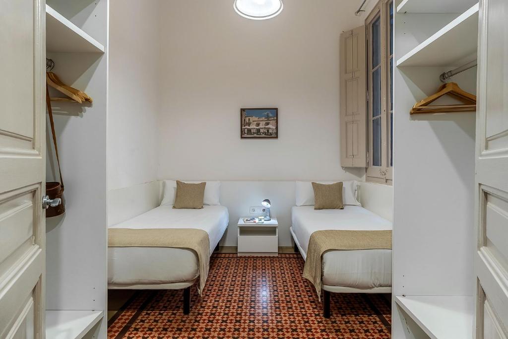 Postel nebo postele na pokoji v ubytování AB Bailen Apartments