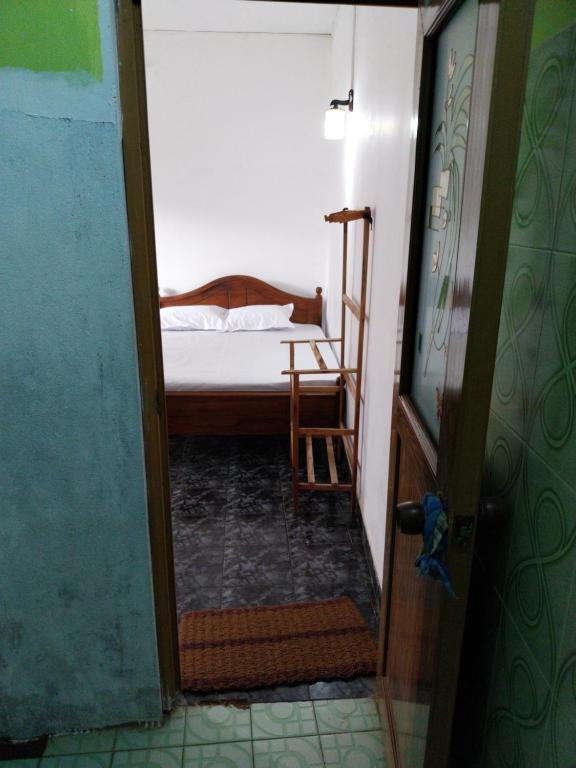 Postel nebo postele na pokoji v ubytování Inuli Coco Hut