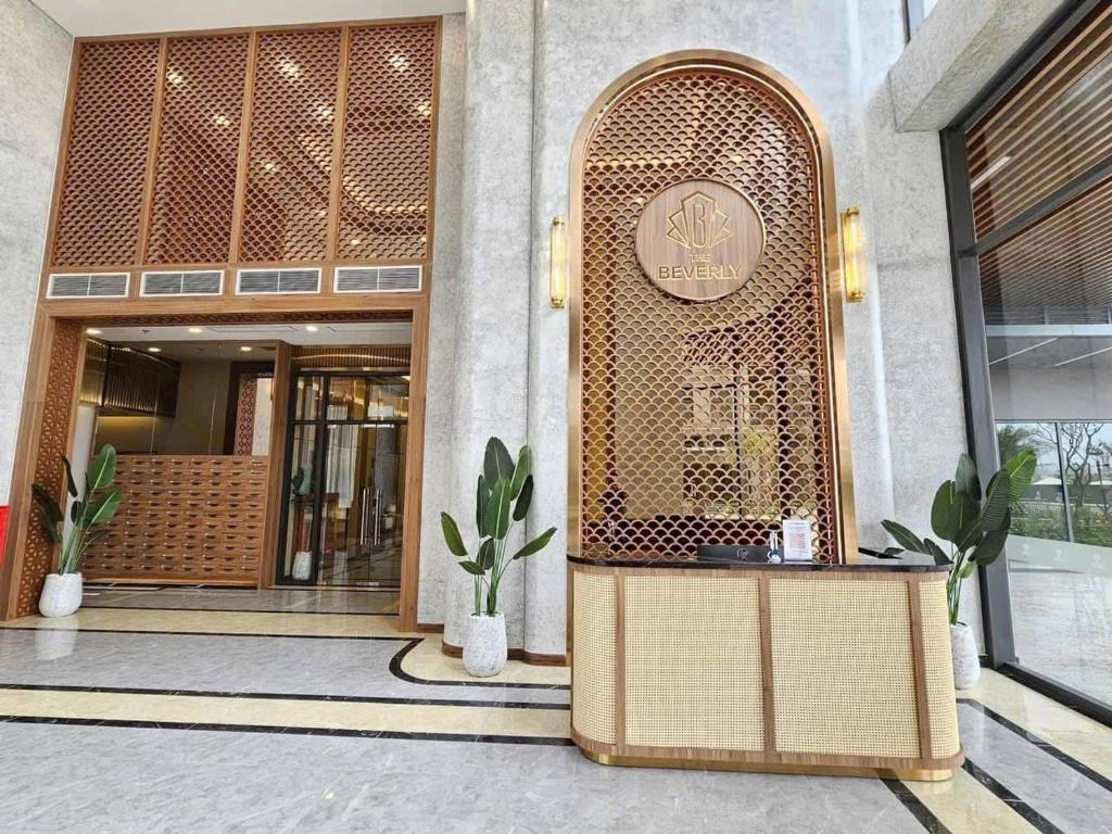 a entrance to a building with a sign on it at AQHOMES at Vinhomes Grand Park in Long Bình