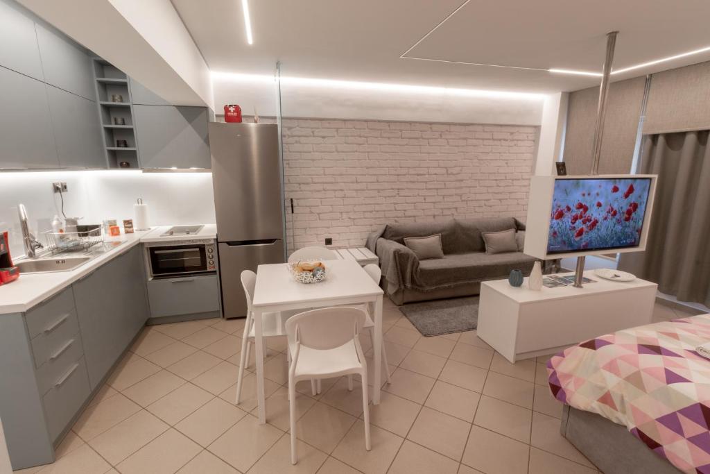 Kuchyň nebo kuchyňský kout v ubytování NAFPAKTOS-luxury suite