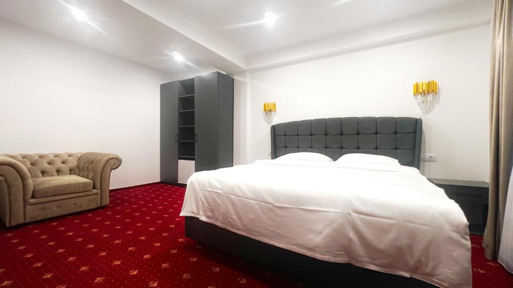 Postel nebo postele na pokoji v ubytování Mimi Hotel