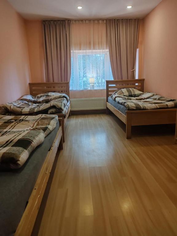 Postel nebo postele na pokoji v ubytování Galaxy Hostel