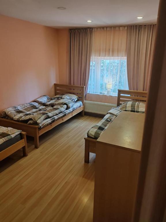 Postel nebo postele na pokoji v ubytování Galaxy Hostel