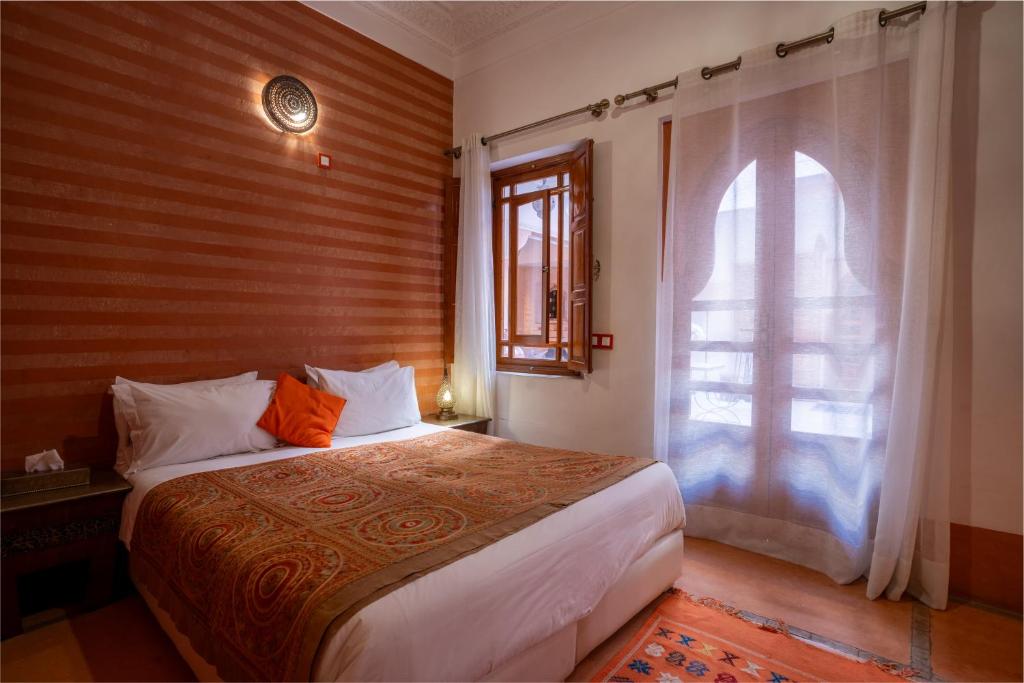 Postel nebo postele na pokoji v ubytování Riad Mazaya