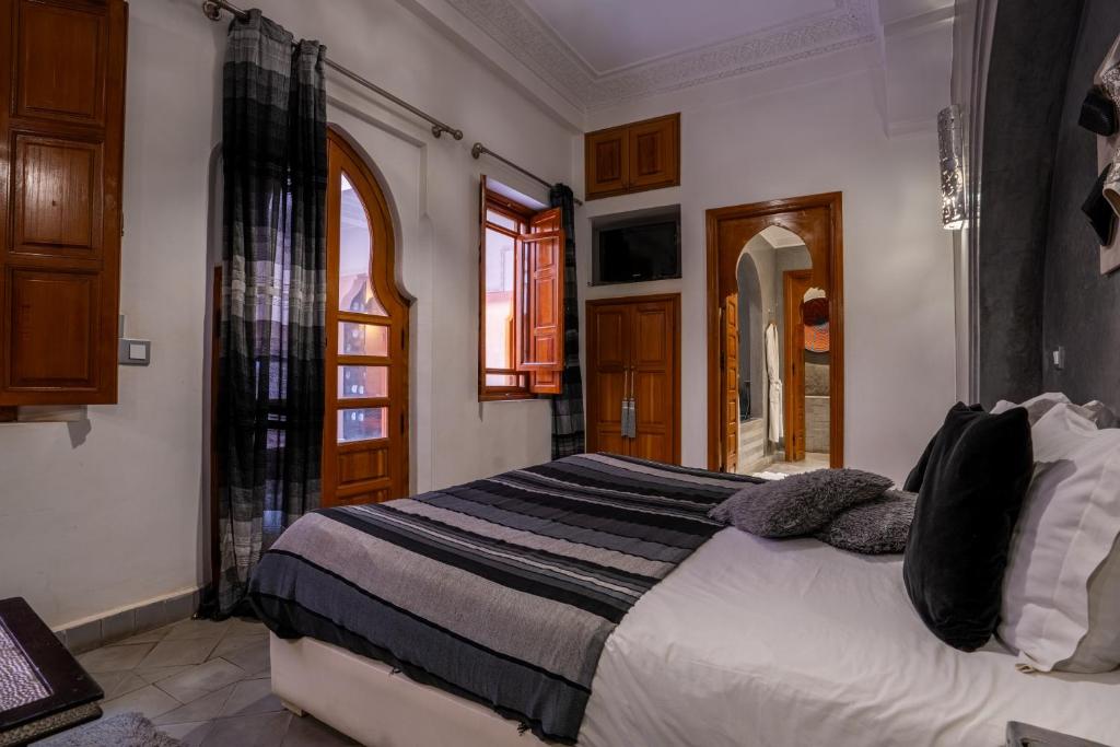Postel nebo postele na pokoji v ubytování Riad Mazaya