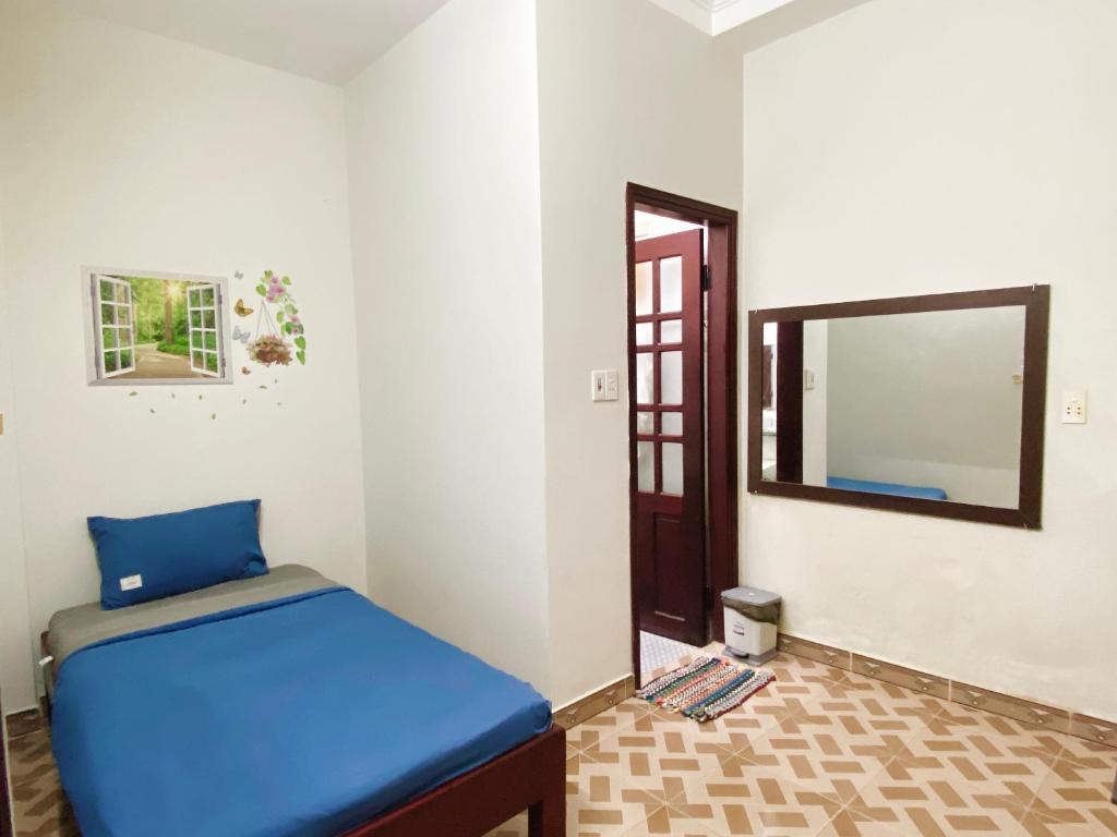 Postel nebo postele na pokoji v ubytování DK House Homestay