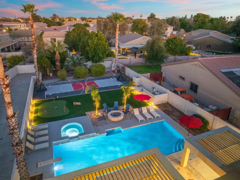 an aerial view of a house with a swimming pool at The Cardinal Walk to Stadium Pool+Spa Sportcourt in Glendale