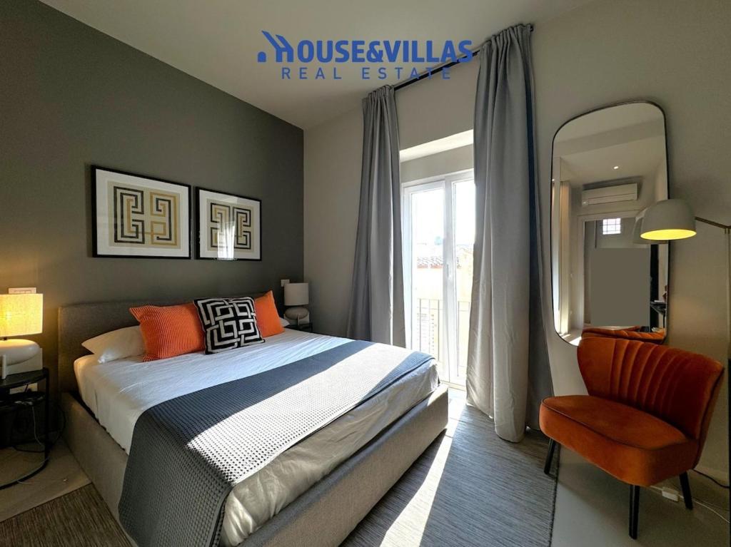 En eller flere senge i et værelse på House&Villas - Casa Lumae