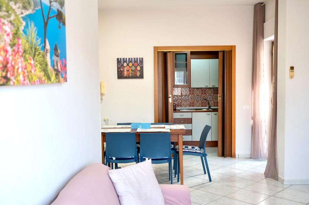a living room and kitchen with a table and chairs at La Valle e il Mare - San Leone in San Leone