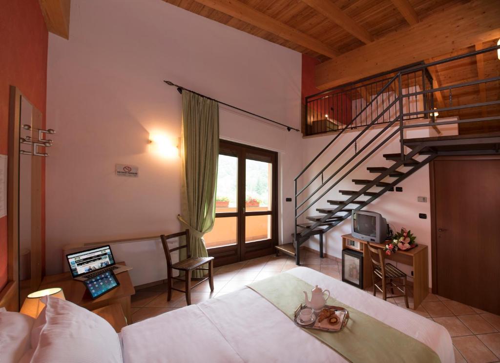 Postel nebo postele na pokoji v ubytování Hotel la Colletta