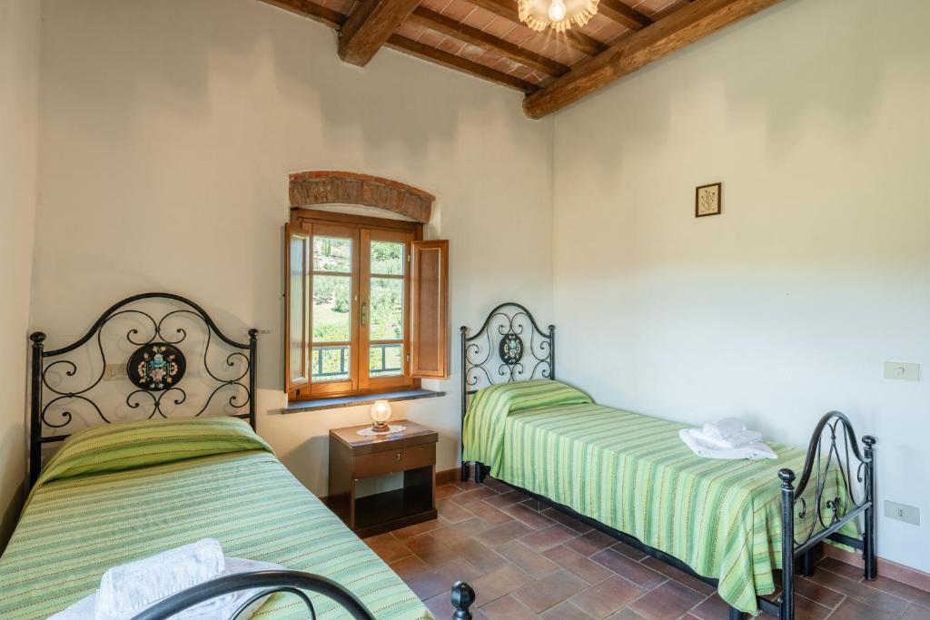 Postel nebo postele na pokoji v ubytování Agriturismo Fadanelli - Le Rondini