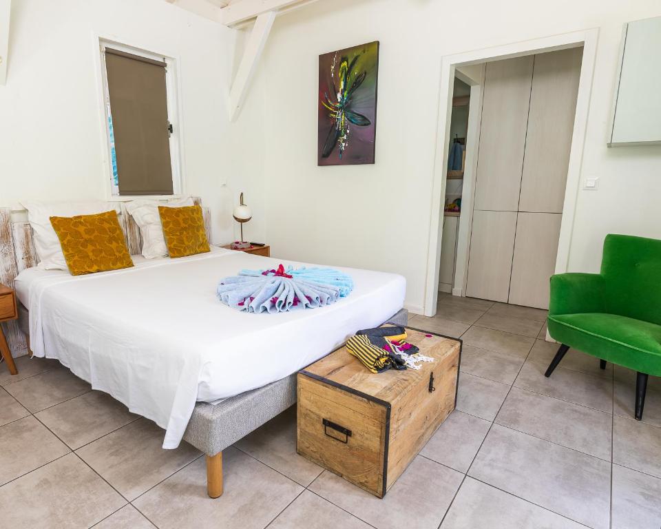 Postel nebo postele na pokoji v ubytování Mon'Désir Lodge - Bungalows