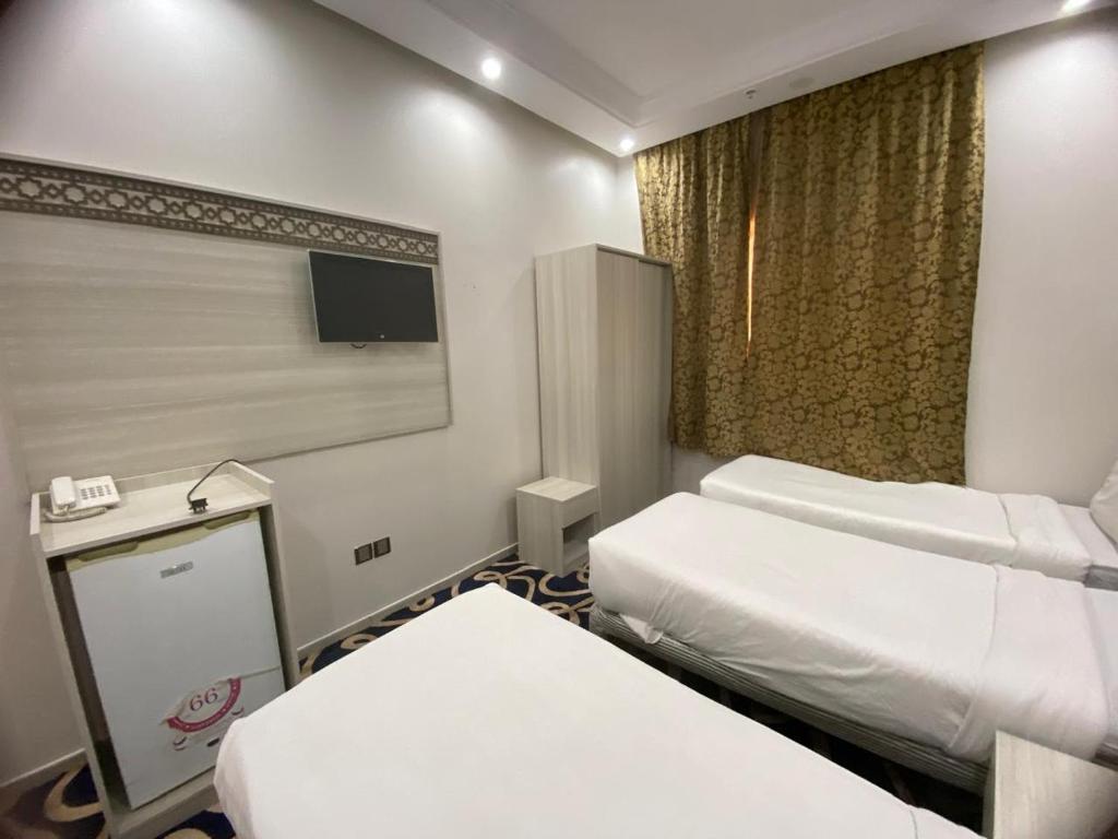 Postel nebo postele na pokoji v ubytování AKABER ELSHESHA awtadhotel2 اكابر الششة اوتاد هوتيل 2