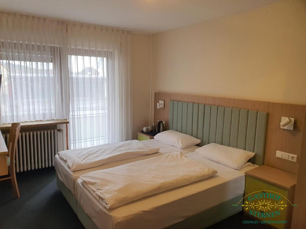 Postel nebo postele na pokoji v ubytování Hotel Gasthof Sternen