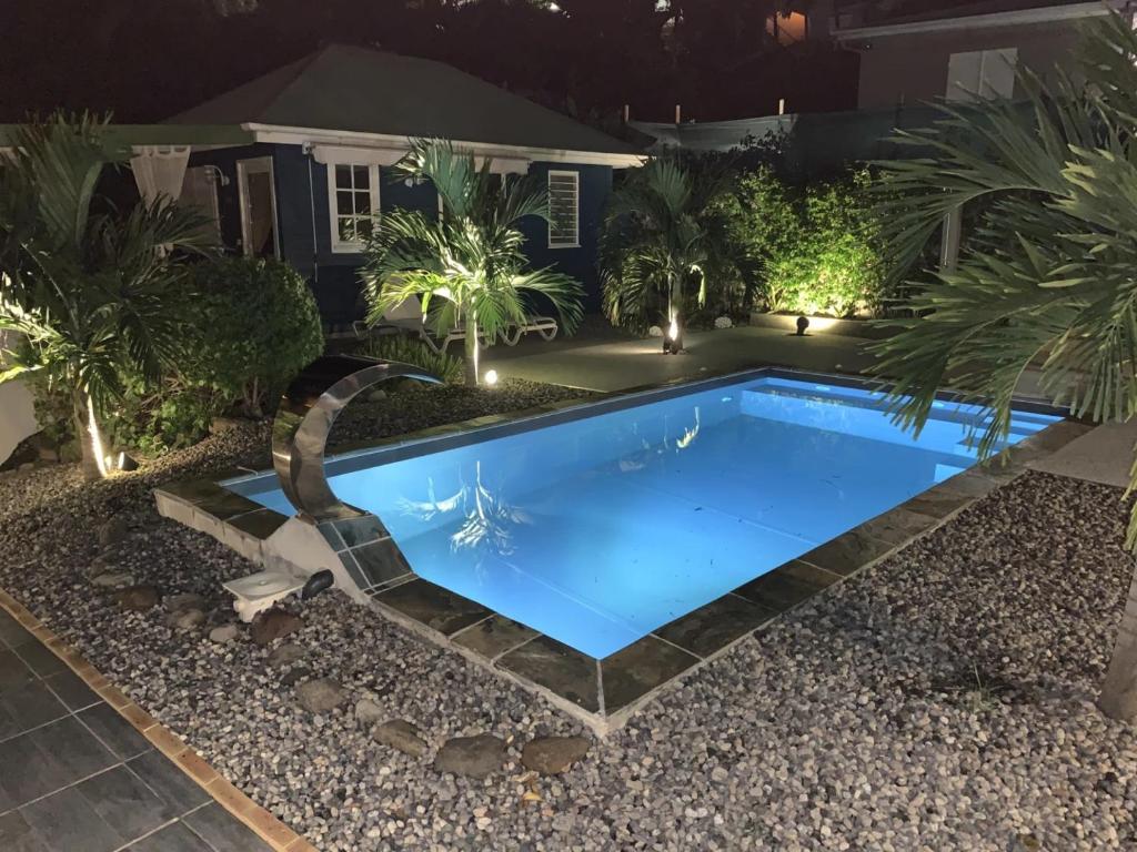 Bazén v ubytování Mon'Désir Lodge - Bungalows nebo v jeho okolí
