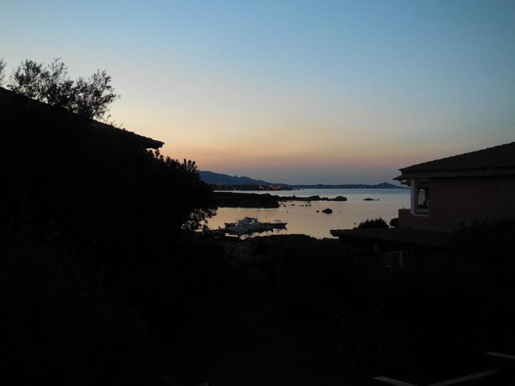 a sunset over a body of water with boats in it at Dany's Home in Baia de Bahas in Santa Marinella