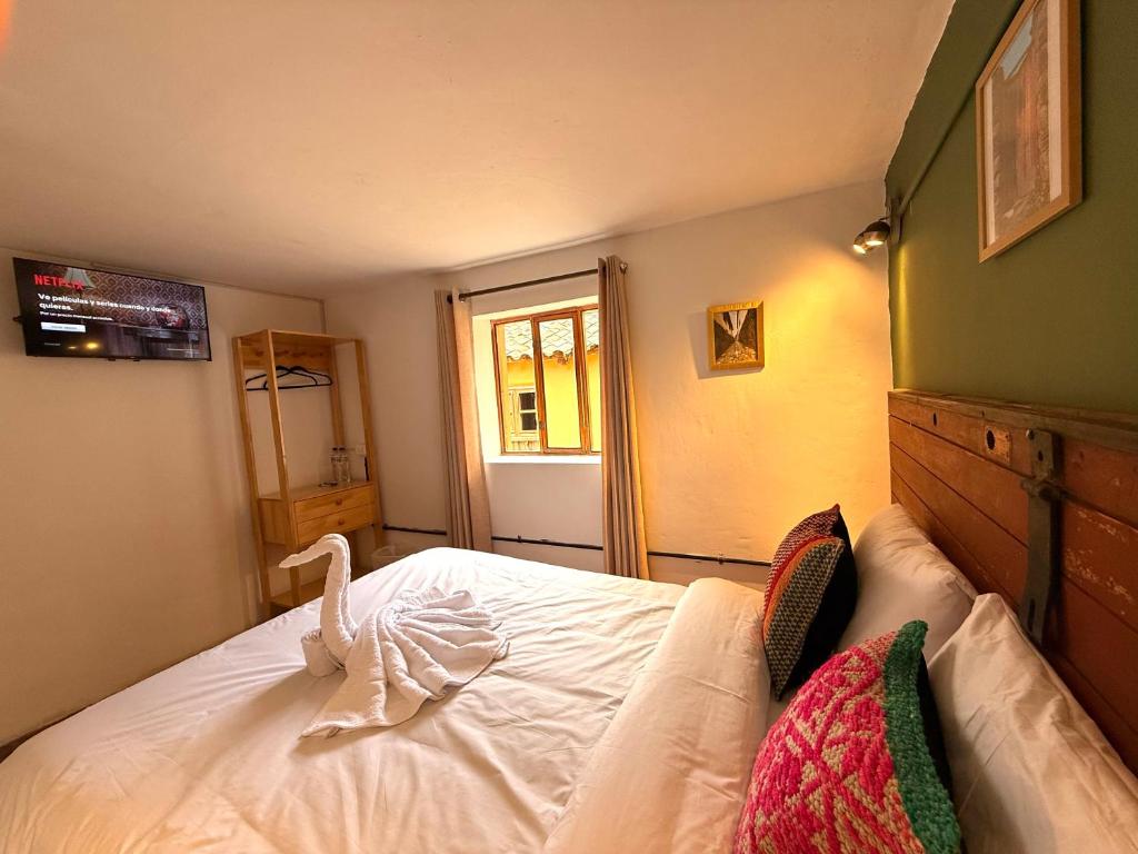 Voodi või voodid majutusasutuse Anido Hotel toas