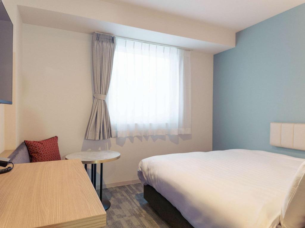 Postel nebo postele na pokoji v ubytování Comfort Hotel Kii Tanabe