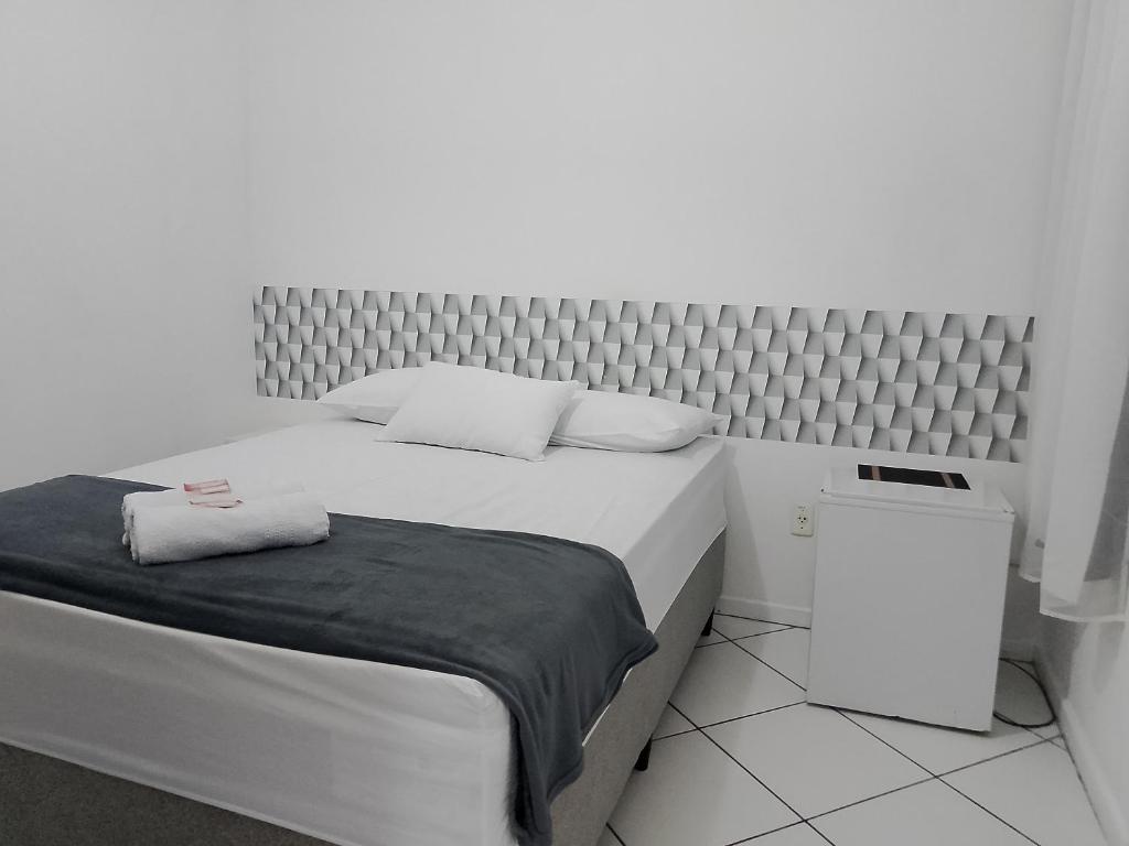 Postel nebo postele na pokoji v ubytování Hotel Aconchegante