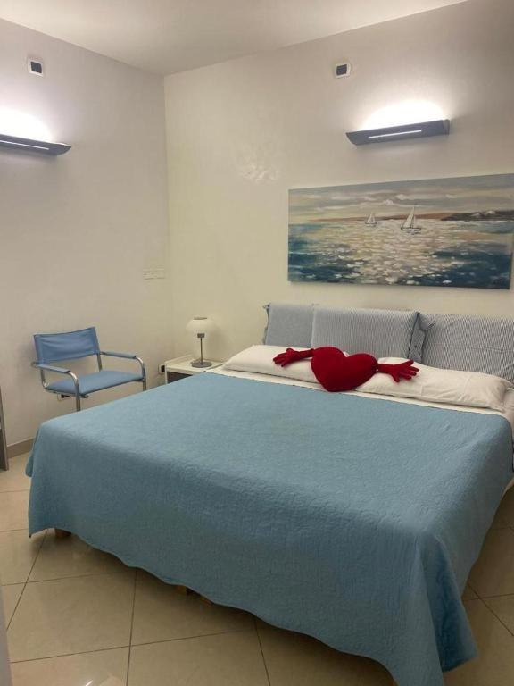Postel nebo postele na pokoji v ubytování Petali Rosa- Dimora Mare