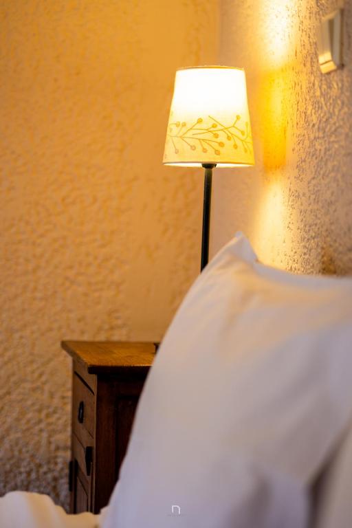 Postel nebo postele na pokoji v ubytování Fanaras Hotel