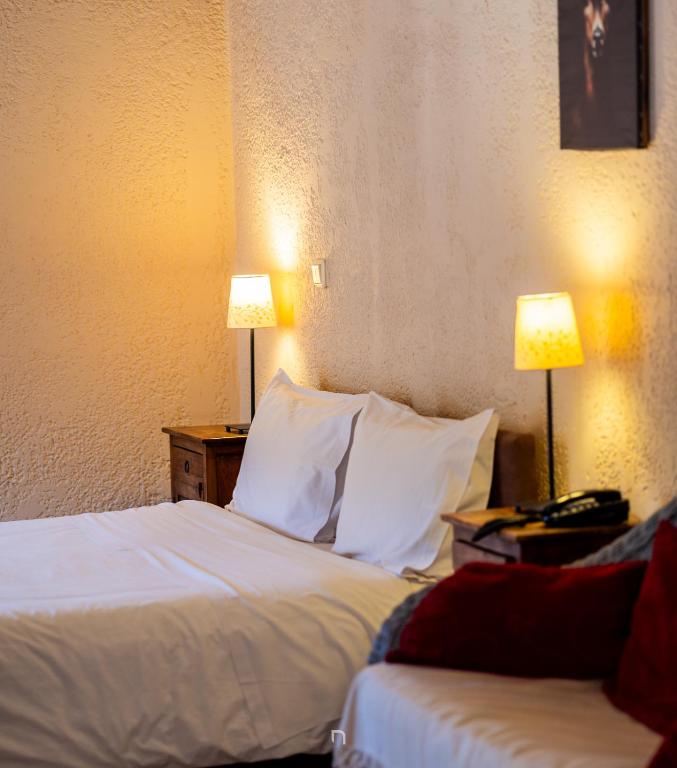Postel nebo postele na pokoji v ubytování Fanaras Hotel