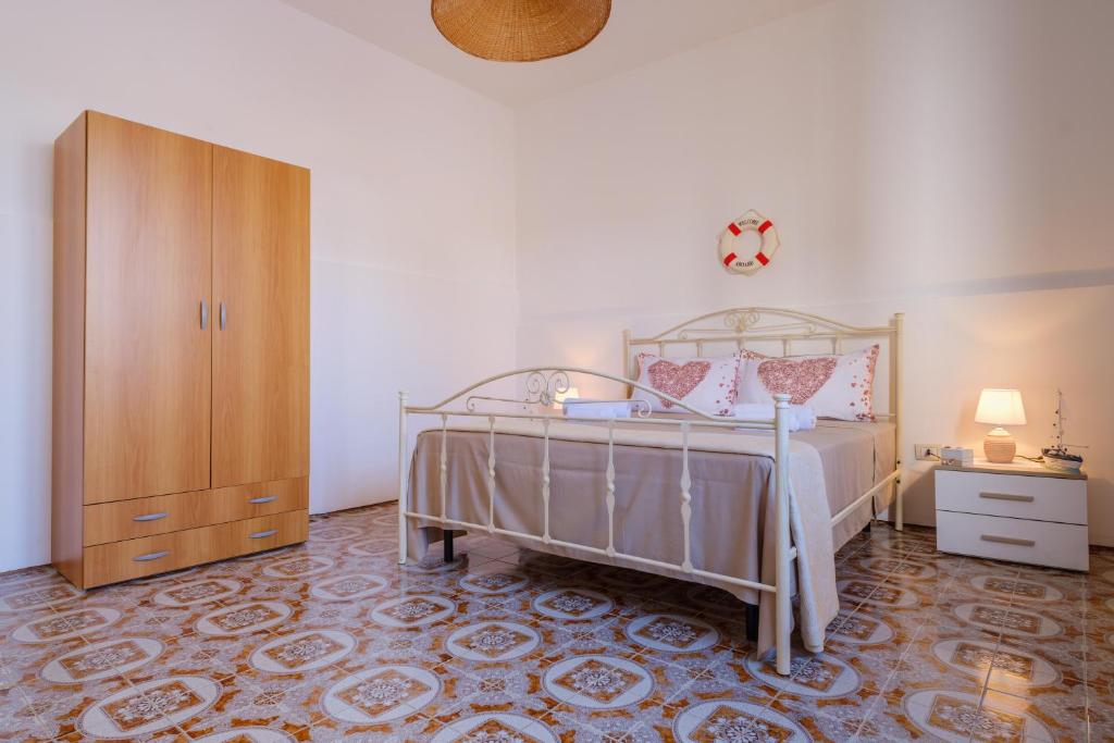 Posteľ alebo postele v izbe v ubytovaní Villa Grecale Porto Cesareo