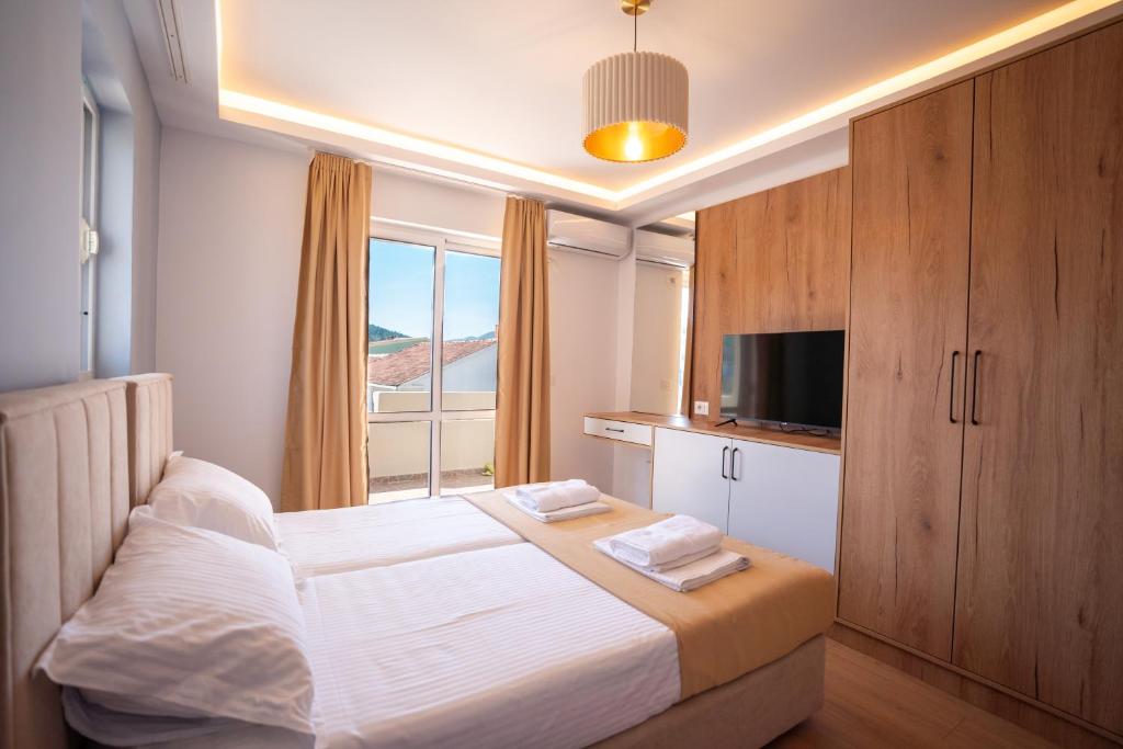 Postel nebo postele na pokoji v ubytování Illyria Hotel