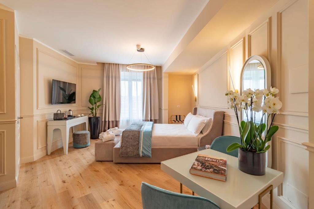 Postel nebo postele na pokoji v ubytování Trevi Imperial Suite 1