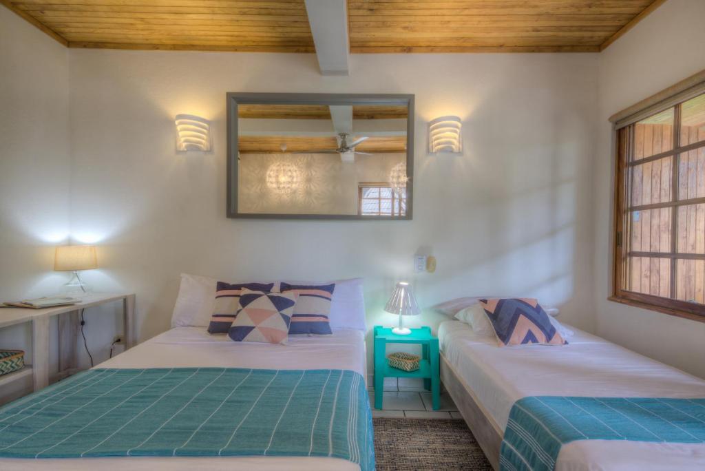 Postel nebo postele na pokoji v ubytování Hotel Guiones