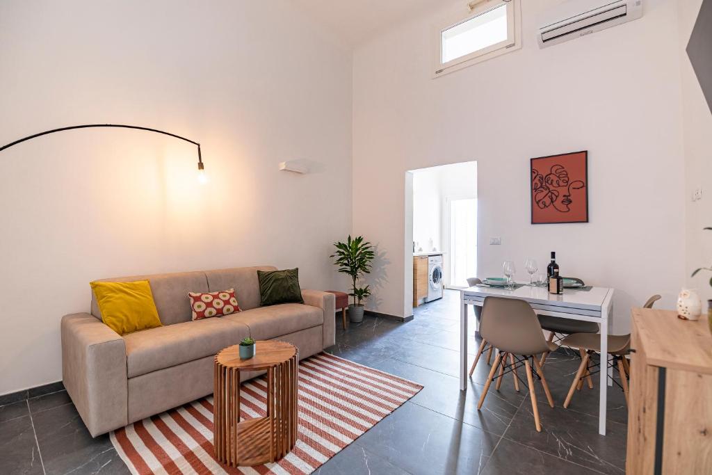 a living room with a couch and a table at Solaris Apartments in Veglie