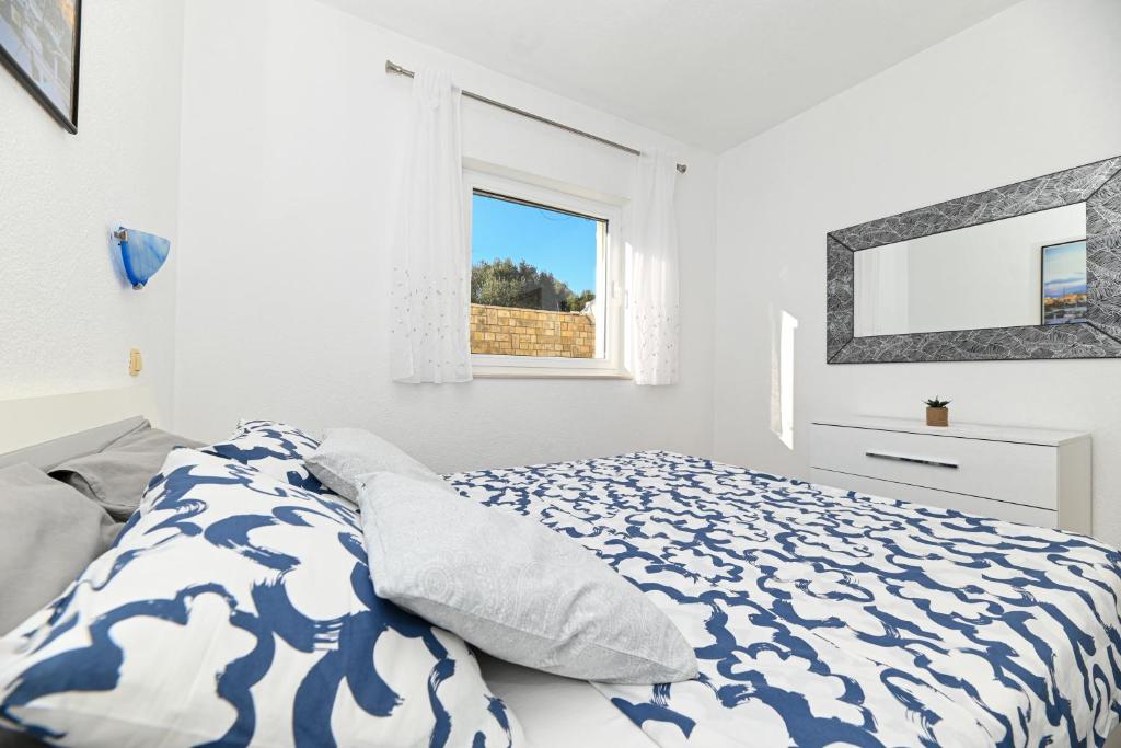 Postel nebo postele na pokoji v ubytování Apartments Patricia