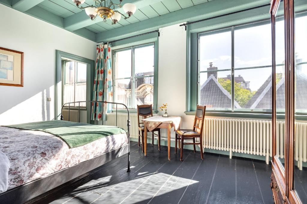 Postel nebo postele na pokoji v ubytování B&B In de Prinsenstraat