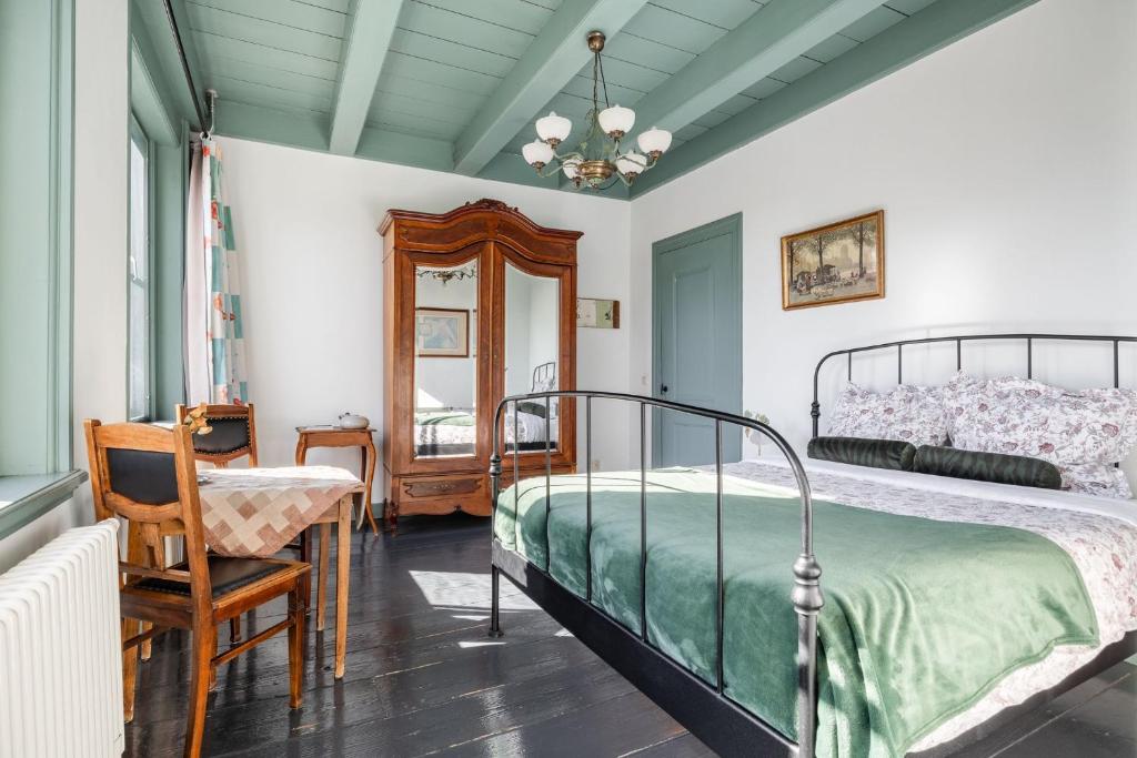 Postel nebo postele na pokoji v ubytování B&B In de Prinsenstraat