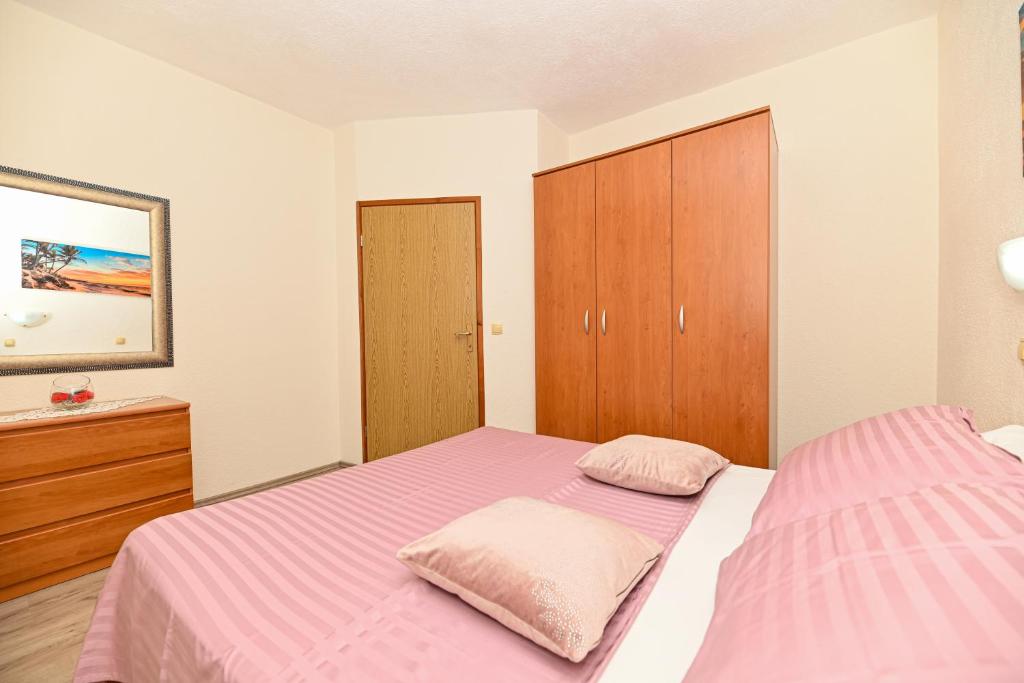 Postel nebo postele na pokoji v ubytování Apartments Patricia