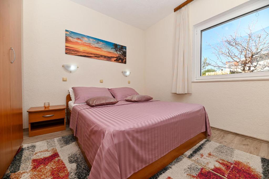 Postel nebo postele na pokoji v ubytování Apartments Patricia